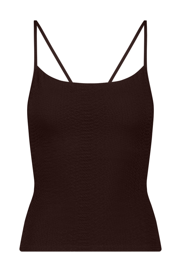 The Lucille Top by Gigi C Sport is a dark brown camisole with thin spaghetti straps. Made from bi-stretch compression fabric, it provides medium support and showcases a subtle textured pattern for added flair.