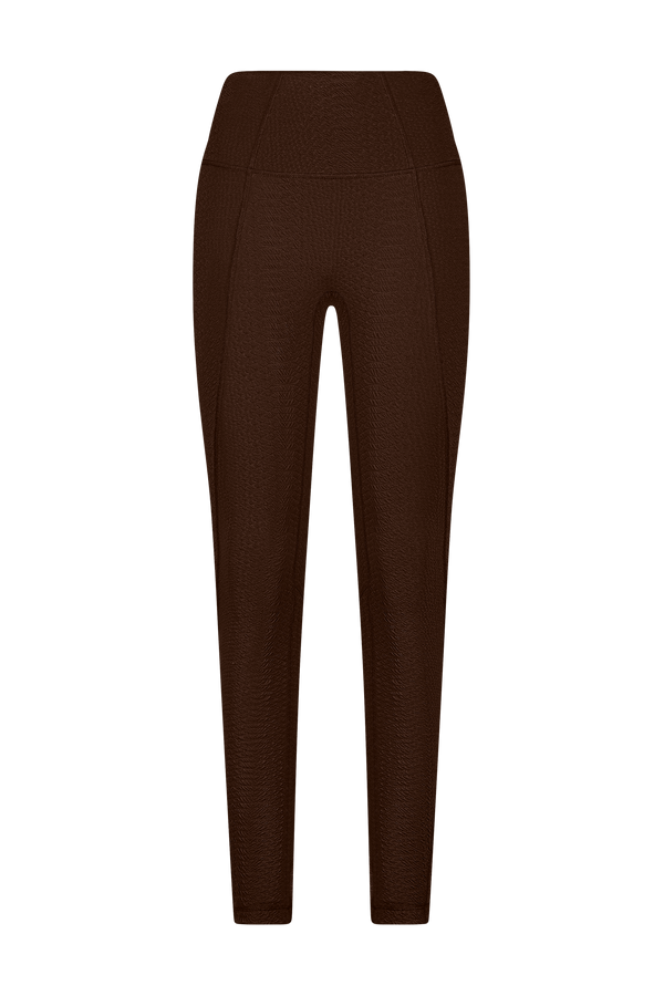 The Ava Legging by Gigi C Sport features a front view of brown faux snakeskin with a high waistband and subtle seam details, set against a black backdrop.