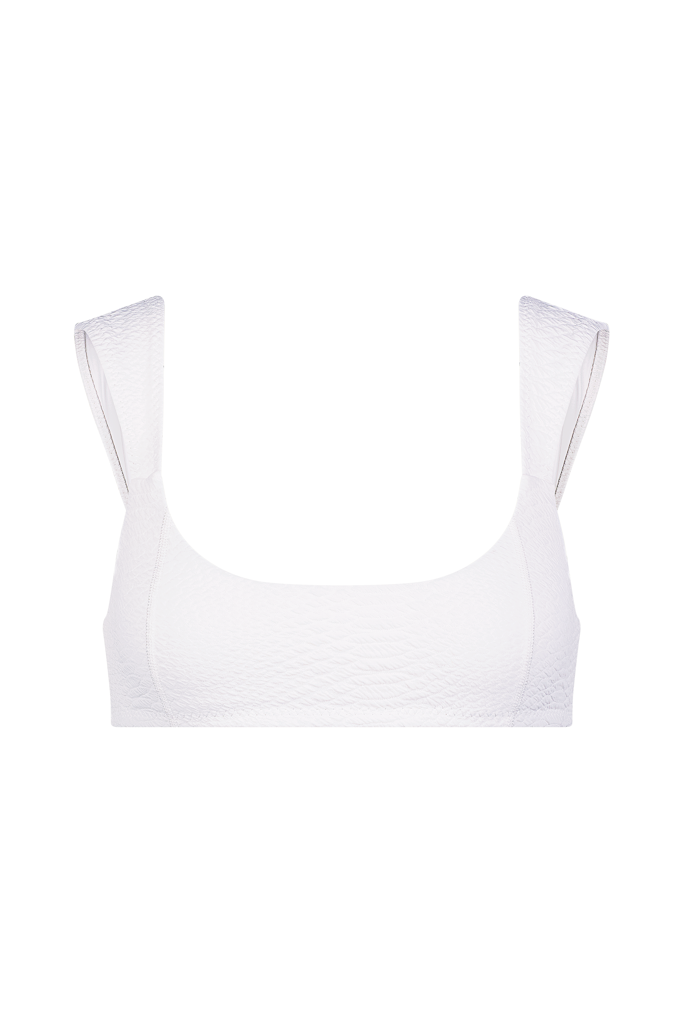 The Gigi C Bikinis Dawson Top, a white textured crop top with wide shoulder straps and flatlock seaming, is elegantly set against a black background.