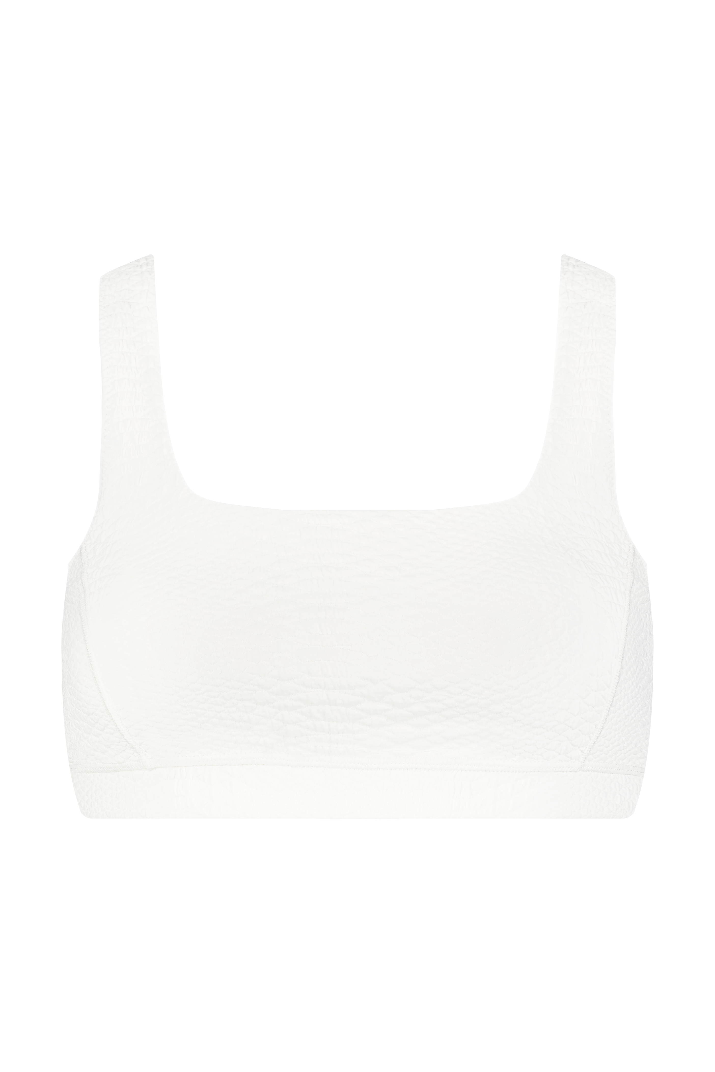 Front view of a Gigi C Sport Wilson Bra in plain white, showcasing wide straps and textured fabric with a square neckline against a solid black background.