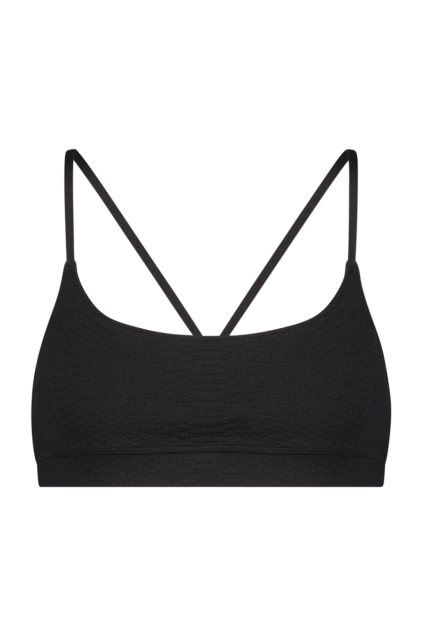 The Gigi C Sport Emery Bra, a black bralette with thin straps, is showcased on a white backdrop, featuring a subtle faux snakeskin texture that exudes simplicity and minimalist design.