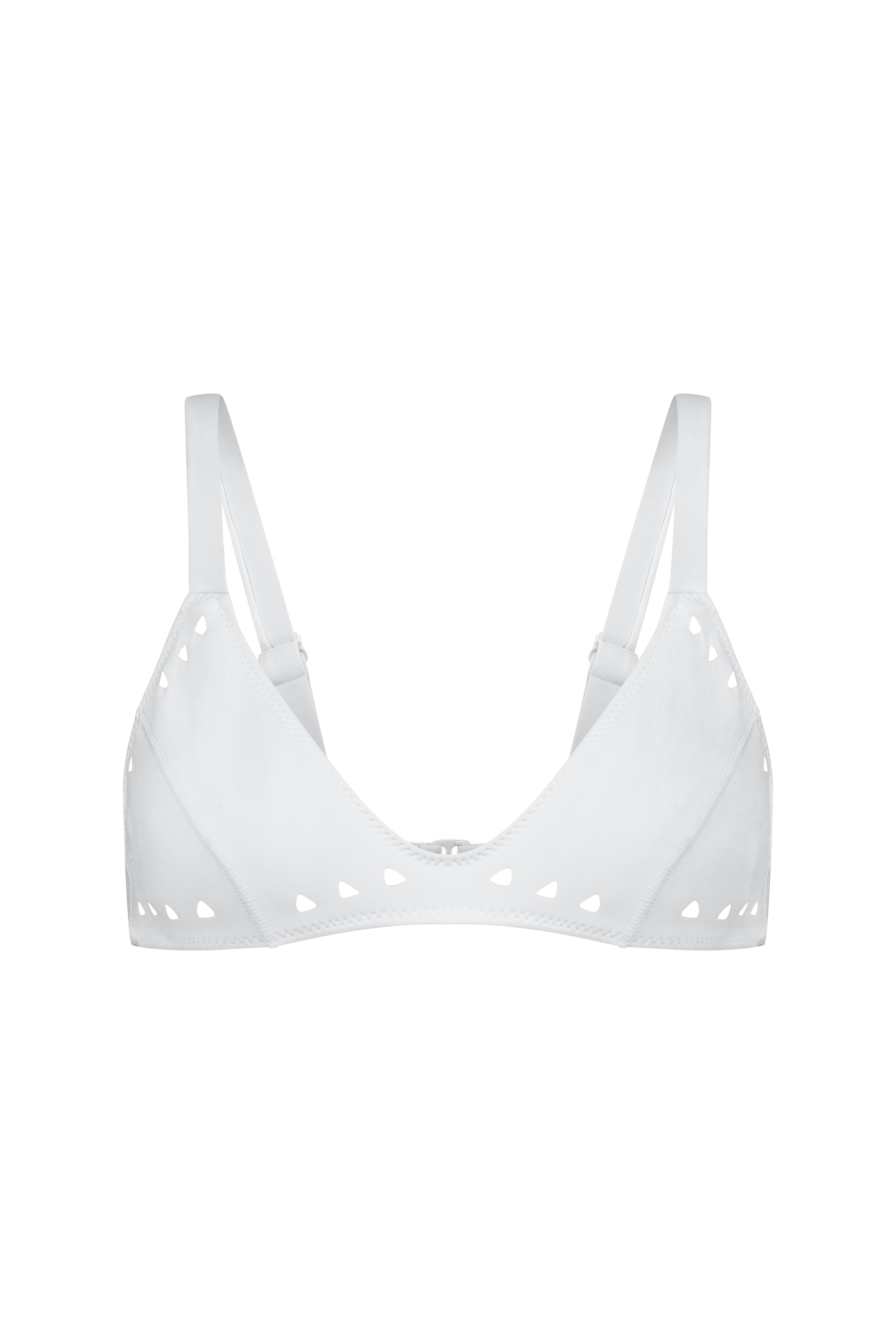 The Georgia Top by Gigi C Bikinis is a white bralette featuring adjustable straps, a semi-sweetheart neckline, and small heart cutouts along the edges.